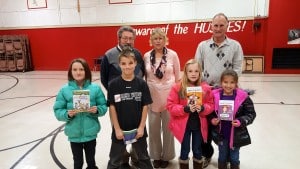 Submitted Third-graders Trinity W., Joshua P, Elisabeth M. and Alainna G. stand with East Geauga Kiwanis President Ken Humphrey, and members Linda Humphrey and Claire Zurbuch after receiving their books from the club.