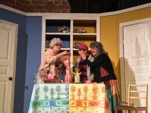 Submitted Fruitcake baking sisters (Tina Burgett-Krause and Civia Wiesner) rope fruitcake snitching runaway (Jack Kane) into kitchen service at Geauga Lyric Theater's production of “Fruitcakes,” running weekends through Dec. 18.